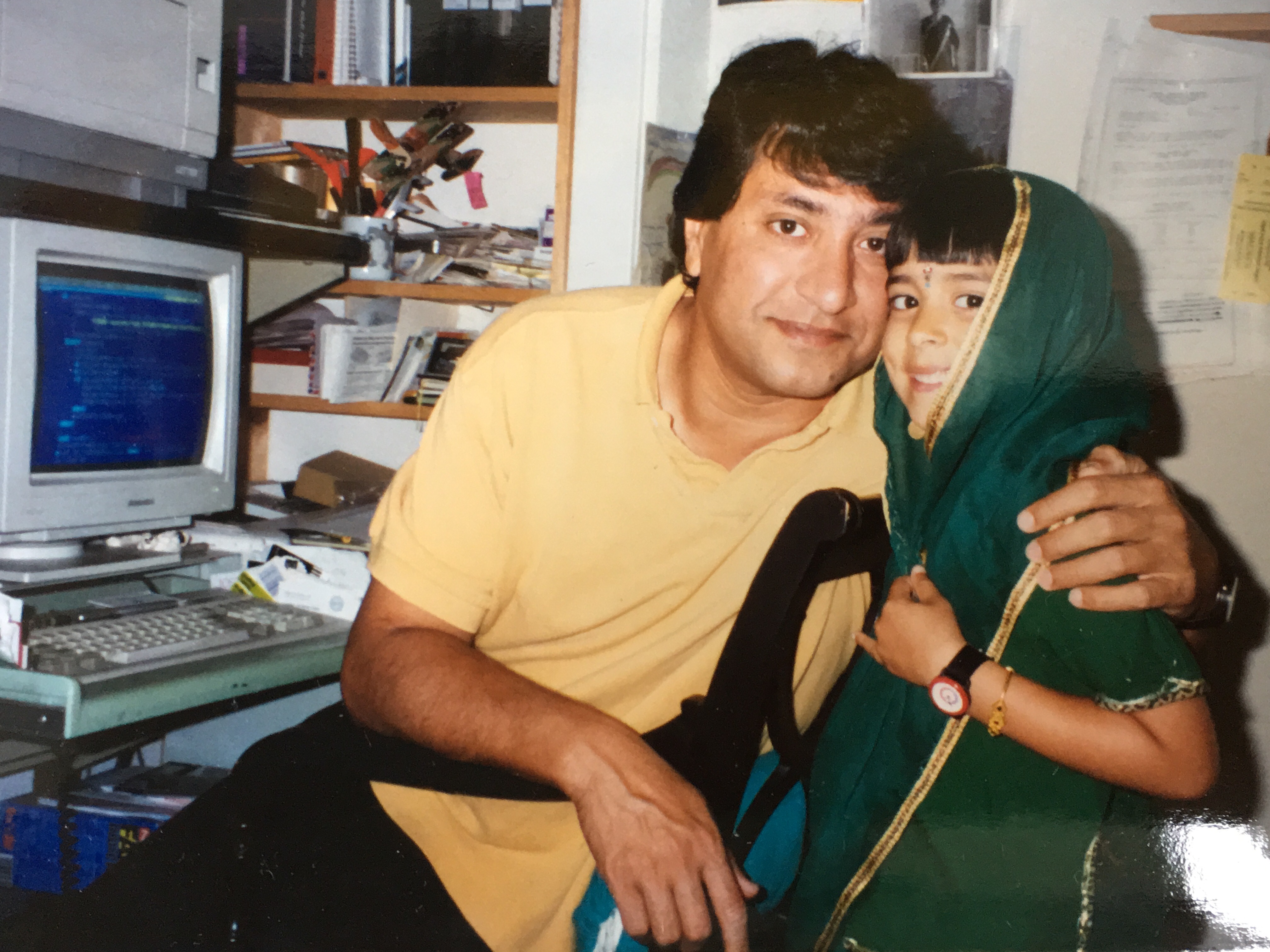 Young Darshini with her father at the computer