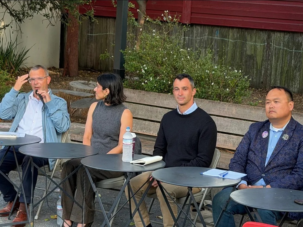 The four District 8 candidates seated at a forum