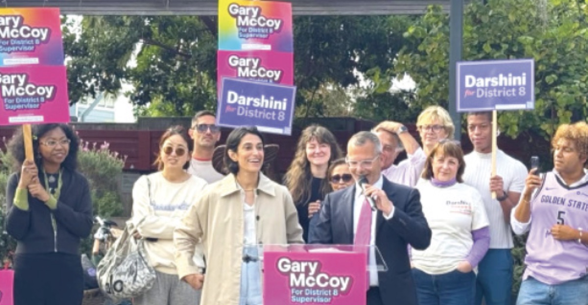 Darshini Patel and Gary McCoy at the alliance announcement, with supporters holding signs for both campaigns