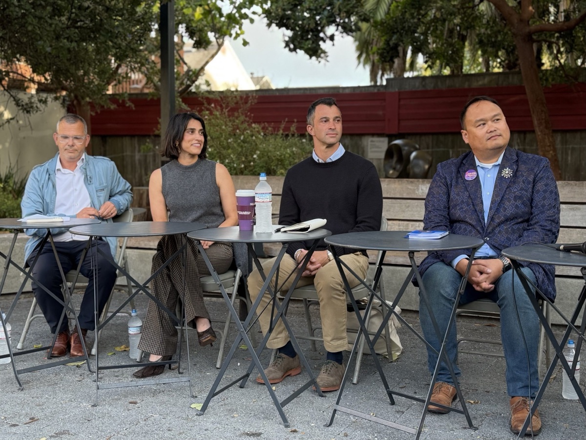 The four District 8 candidates seated at a forum